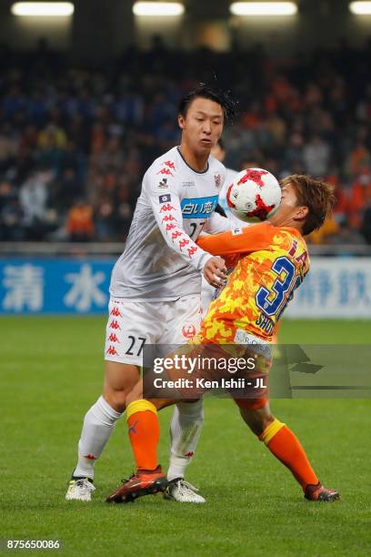 Takuma Arano of Consadole Sapporo and Shota Kaneko of Shimizu S-Pulse compete for the ball during the J.League J1 match between Shimizu S-Pulse and...