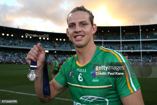 Nathan Fyfe of Australia poses with the player of the series medal after winning game two and the series of the International Rules Series between...