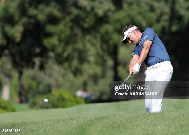 Ian Poulter of England plays a shot during the third round of the DP World Tour Championship at Jumeirah Golf Estates in Dubai on November 18, 2017....