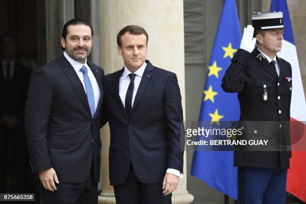 French President Emmanuel Macron welcomes Lebanese Prime Minister Saad Hariri at the Elysee Presidential Palace on November 18, 2017 in Paris. Hariri...