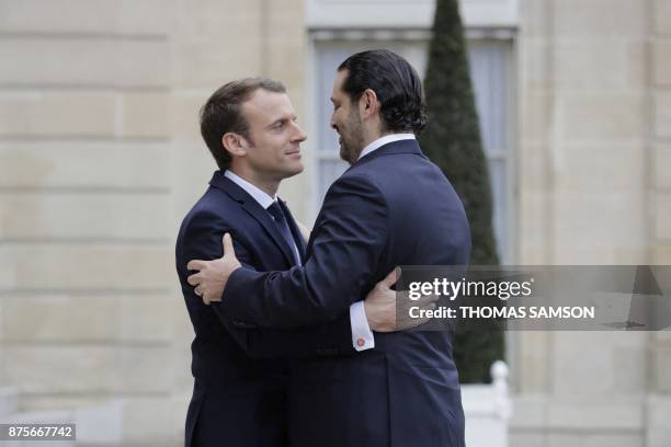 French President Emmanuel Macron welcomes Lebanese Prime Minister Saad Hariri at the Elysee Presidential Palace on November 18, 2017 in Paris. Hariri...