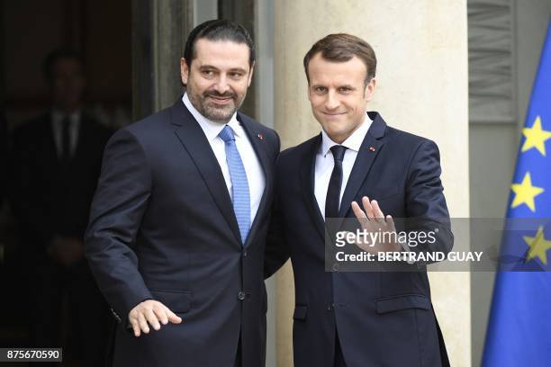 French President Emmanuel Macron gestures as he welcomes Lebanese Prime Minister Saad Hariri at the Elysee Presidential Palace on November 18, 2017...