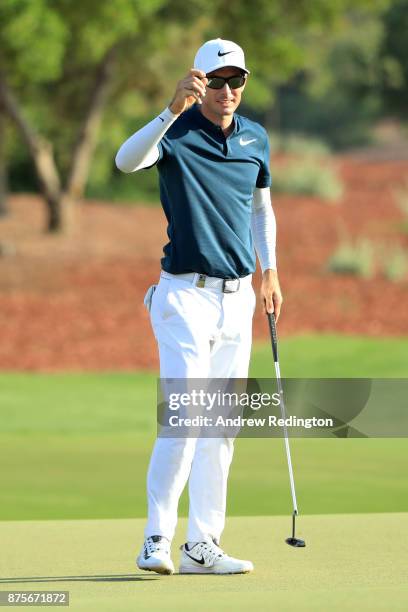 Dylan Frittelli of South Africa acknowledges the crowd on the 18th green during the third round of the DP World Tour Championship at Jumeirah Golf...