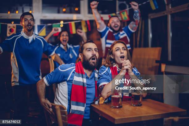 group of friends at the bar - rugby fan stock pictures, royalty-free photos & images