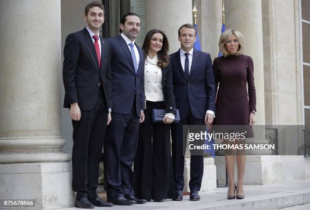 French President Emmanuel Macron and his wife Brigitte Macron welcome Lebanese Prime Minister Saad Hariri , his wife Lara Bachir El-Alzm and their...