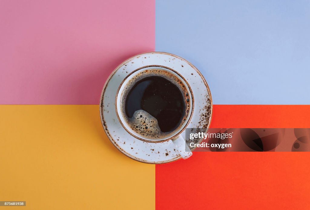 Cup of Coffee on colored background