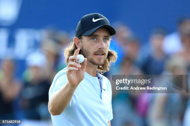 Tommy Fleetwood of England acknowledges the crowd on the 18th hole during the third round of the DP World Tour Championship at Jumeirah Golf Estates...