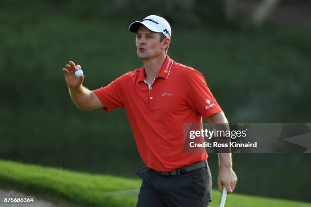 Justin Rose of England celebrates a birdie on the 16th green during the third round of the DP World Tour Championship at Jumeirah Golf Estates on...