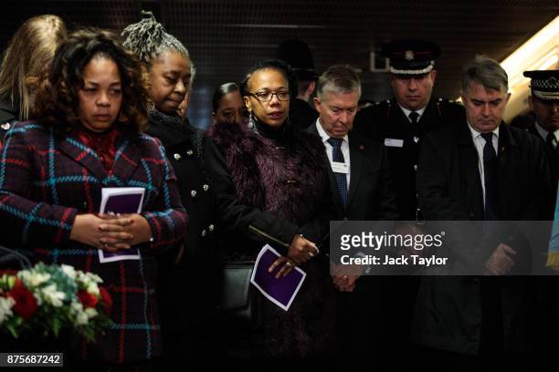 Relatives, survivors and members of the emergency services attend a memorial to mark the 30th anniversary of the King's Cross fire at King's Cross...