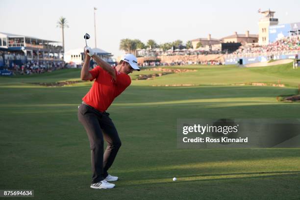 Justin Rose of England hits his second shot on the 18th hole during the third round of the DP World Tour Championship at Jumeirah Golf Estates on...