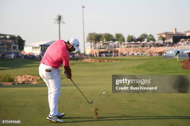 Jon Rahm of Spain hits his second shot on the 18th hole during the third round of the DP World Tour Championship at Jumeirah Golf Estates on November...