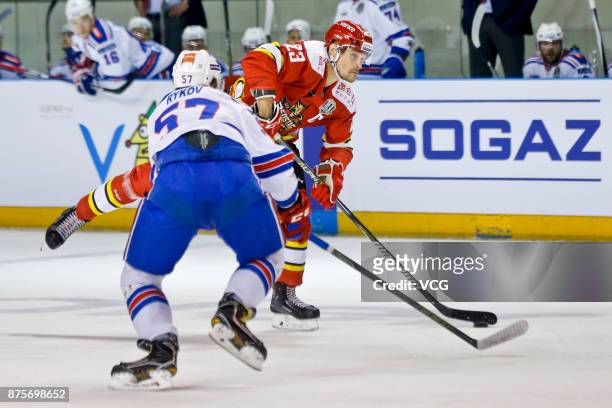 Alexei Ponikarovsky of HC Kunlun Red Star and Yegor Rykov of SKA Saint Petersburg vie for the puck during the 2017/18 Kontinental Hockey League...