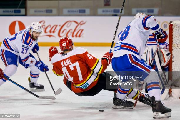 Cory Kane of HC Kunlun Red Star and Vyacheslav Voynov of SKA Saint Petersburg vie for the puck during the 2017/18 Kontinental Hockey League Regular...