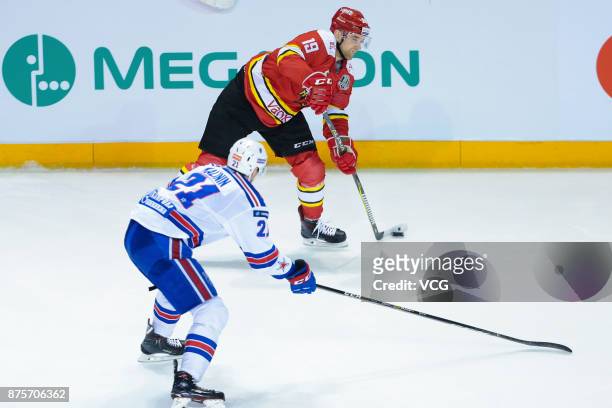 Brandon DeFazio of HC Kunlun Red Star and Sergei Kalinin of SKA Saint Petersburg vie for the puck during the 2017/18 Kontinental Hockey League...
