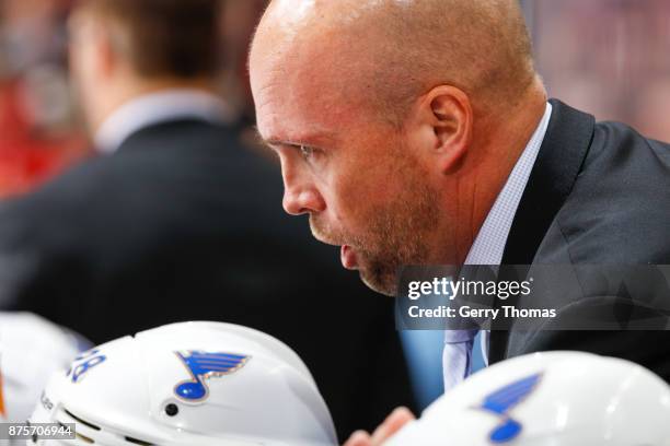 St. Luis Blues Head Coach Mike Yeo gives instructions in an NHL game against the St. Louis Blues at the Scotiabank Saddledome on November 13, 2017 in...