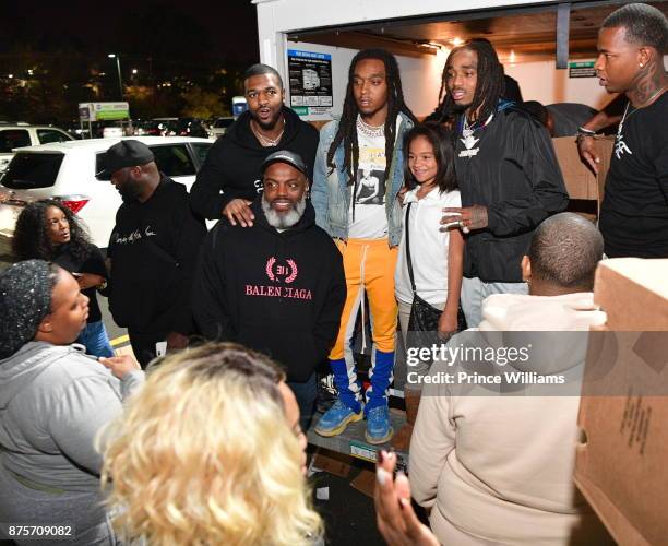 Kevin 'Coach K' Lee, Takeoff and Quavo of The Group Migos attends The Migos Turkey Drive at 799 Hutchins Road on November 17, 2017 in Atlanta,...