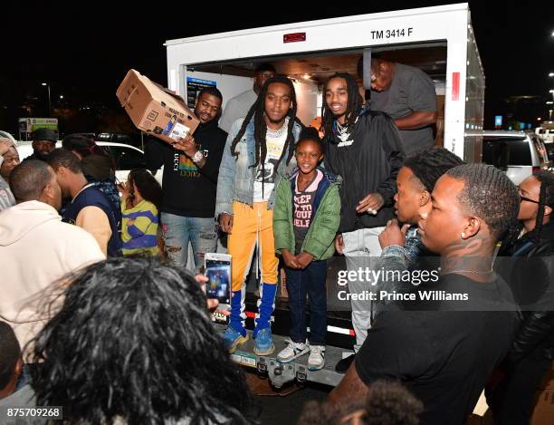 Takeoff and Quavo of the Group Migos hand out Turkeys at The Migos Turkey Drive at 799 Hutchins Road on November 17, 2017 in Atlanta, Georgia.