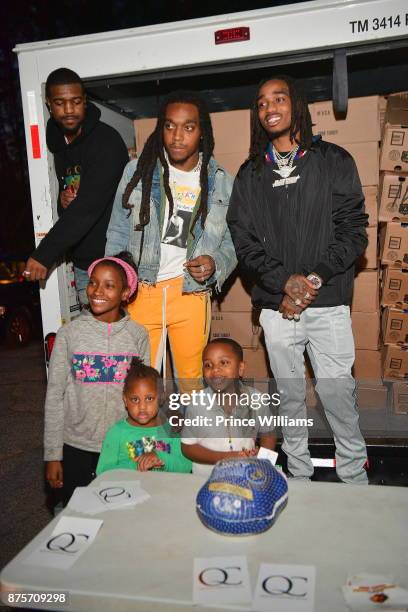 Takeoff and Quavo of the Group Migos hand out Turkeys at The Migos Turkey Drive at 799 Hutchins Road on November 17, 2017 in Atlanta, Georgia.