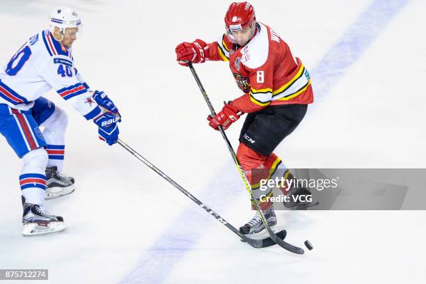 Sergei Peretyagin of HC Kunlun Red Star and Nikita Gusev of SKA Saint Petersburg vie for the puck during the 2017/18 Kontinental Hockey League...