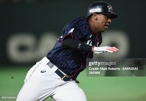 Outfielder Louis Okoye of Japan runs to score by the RBI double of Infielder Shuta Tonosaki to make it 8-0 in the top of ninth inning during the...
