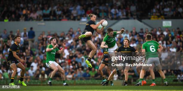 Perth , Australia - 18 November 2017; Nat Fyfe of Australia jumps higher than Kevin Feely of Ireland, to make a mark, during the Virgin Australia...