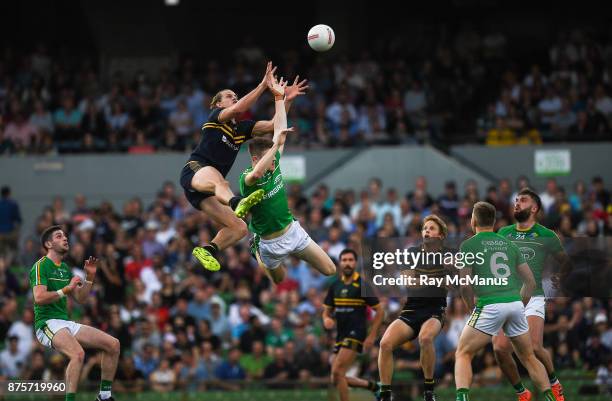 Perth , Australia - 18 November 2017; Nat Fyfe of Australia jumps higher than Kevin Feely of Ireland, to make a mark, during the Virgin Australia...