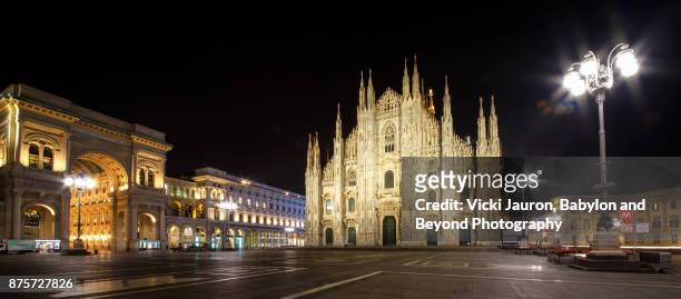panorama of the duomo at night in milan, italy - cathedral foto e immagini stock