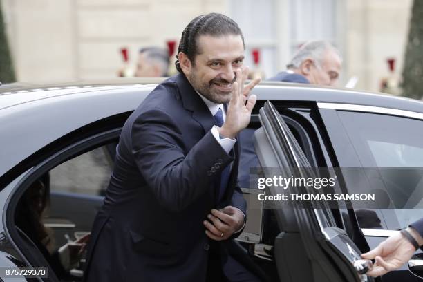 Lebanese Prime Minister Saad Hariri gestures as he steps into a car as he leaves after meeting with French President at the Elysee Presidential...