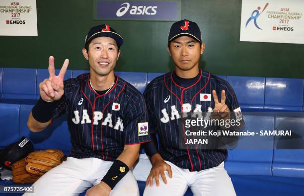 Pitcher Shota Imanaga and Infielder Shuta Tonosaki of Japan pose for photographs after the Eneos Asia Professional Baseball Championship 2017 game...