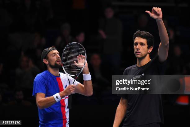 Brazil's Marcelo Melo and his partner Poland's Lukasz Kubot celebrate beating US player Ryan Harrison and New Zealand's Michael Venus during their...