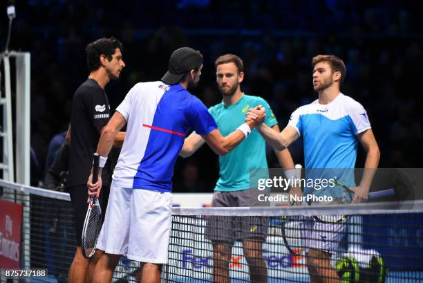 Brazil's Marcelo Melo and his partner Poland's Lukasz Kubot shake hands at the net with US player Ryan Harrison and New Zealand's Michael Venus after...