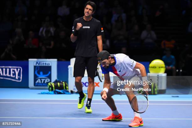 Brazil's Marcelo Melo and his partner Poland's Lukasz Kubot celebrate beating US player Ryan Harrison and New Zealand's Michael Venus during their...