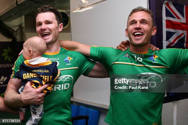 Patrick Dangerfield and Joel Selwood of Australia celebrate after winning game two and the series of the International Rules Series between Australia...