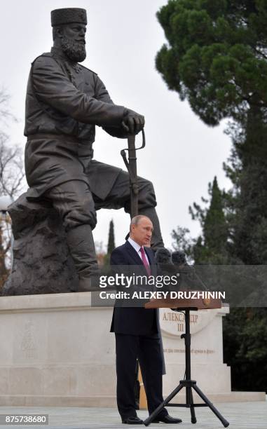 Russian President Vladimir Putin delivers a speech during the unveiling ceremony of a monument to Tsar Alexander III, the father of the last Romanov...