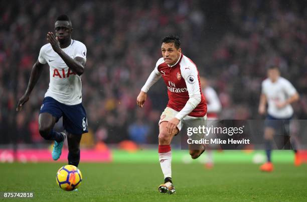 Davinson Sanchez of Tottenham Hotspur and Alexis Sanchez of Arsenal in action during the Premier League match between Arsenal and Tottenham Hotspur...