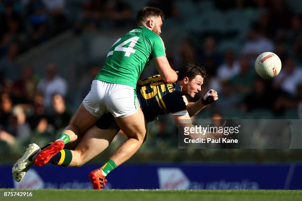 Patrick Dangerfield of Australia gets his hand pass away while being tackled by Aidan O'Shea of Ireland during game two of the International Rules...