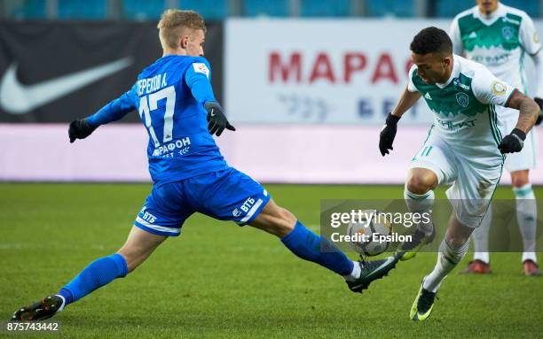 Anton Terekhov of FC Dinamo Moscow vies for the ball with Ismail Silva of FC Akhmat Grozny during the Russian Premier League match between FC Dinamo...