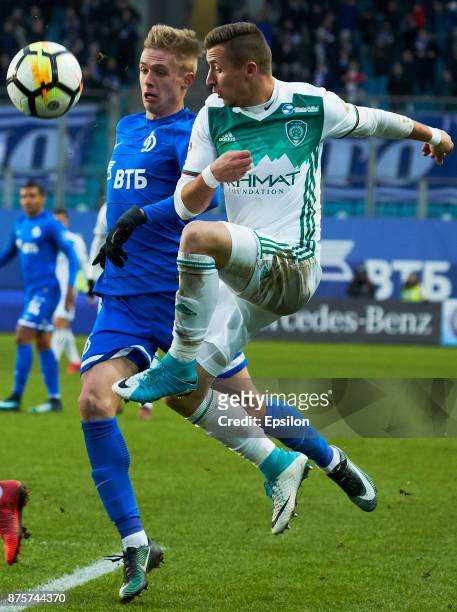 Anton Terekhov of FC Dinamo Moscow vies for the ball with Bernand Berisha of FC Akhmat Grozny during the Russian Premier League match between FC...