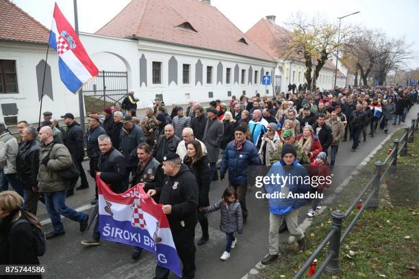 Thousands of people march on the 26th anniversary of the Vukovar massacre in Vukovar, Croatia on November 18, 2017. The Vukovar massacre was the...