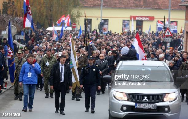 Soldiers and people attend the march for the commemoration ceremony on the 26th anniversary of the Vukovar massacre in Vukovar, Croatia on November...