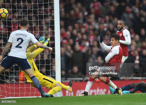 Alexis Sanchez scores Arsenal's second goal during the Premier League match between Arsenal and Tottenham Hotspur at Emirates Stadium on November 18,...