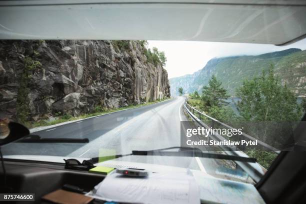 view on curvy road from cabin of campervan - windscreen stock pictures, royalty-free photos & images