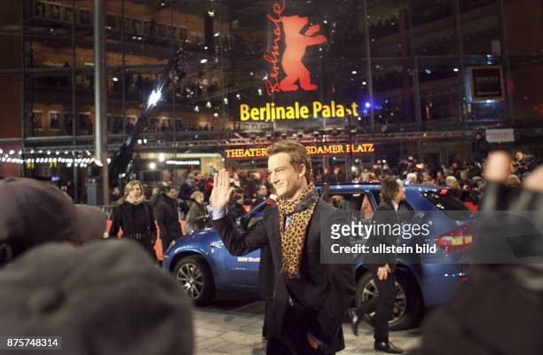Germany Berlin Alexander Fehling waves to fans in front of the Berlinale Palace.