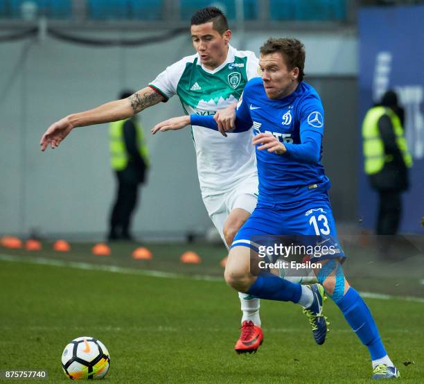 Sergey Terehov of FC Dinamo Moscow vies for the ball with Odise Roshi of FC Akhmat Grozny during the Russian Premier League match between FC Dinamo...