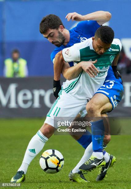 Anton Sosnin of FC Dinamo Moscow vies for the ball with Ismail Silva of FC Akhmat Grozny during the Russian Premier League match between FC Dinamo...