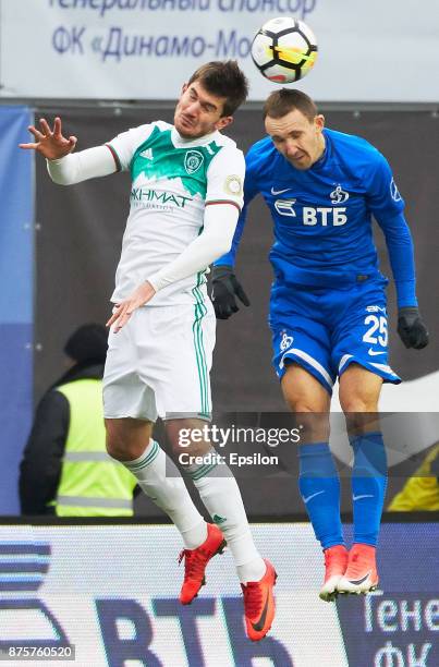 Aleksei Kozlov of FC Dinamo Moscow vies for the ball with Zaurbek Pliev of FC Akhmat Grozny during the Russian Premier League match between FC Dinamo...