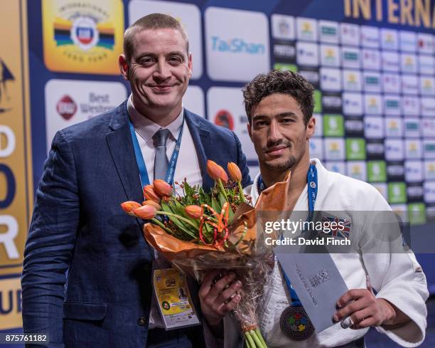 Camberley Judo Club and British Judo coach, Luke Preston proudly stands beside u60kg silver medallist, Ashley Mckenzie during the The Hague Judo...