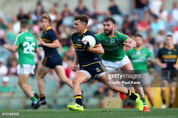 Shaun Higgins of Australia looks to break clear of Aidan O'Shea of Ireland during game two of the International Rules Series between Australia and...