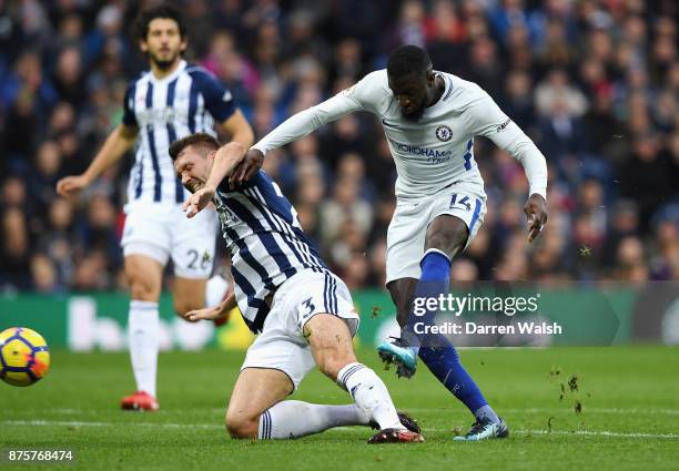 Tiemoue Bakayoko of Chelsea shoots under pressure from Gareth McAuley of West Bromwich Albion during the Premier League match between West Bromwich...