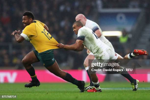 Samu Kerevi of Australia is held back by Jonathan Joseph of England during the Old Mutual Wealth Series match between England and Australia at...